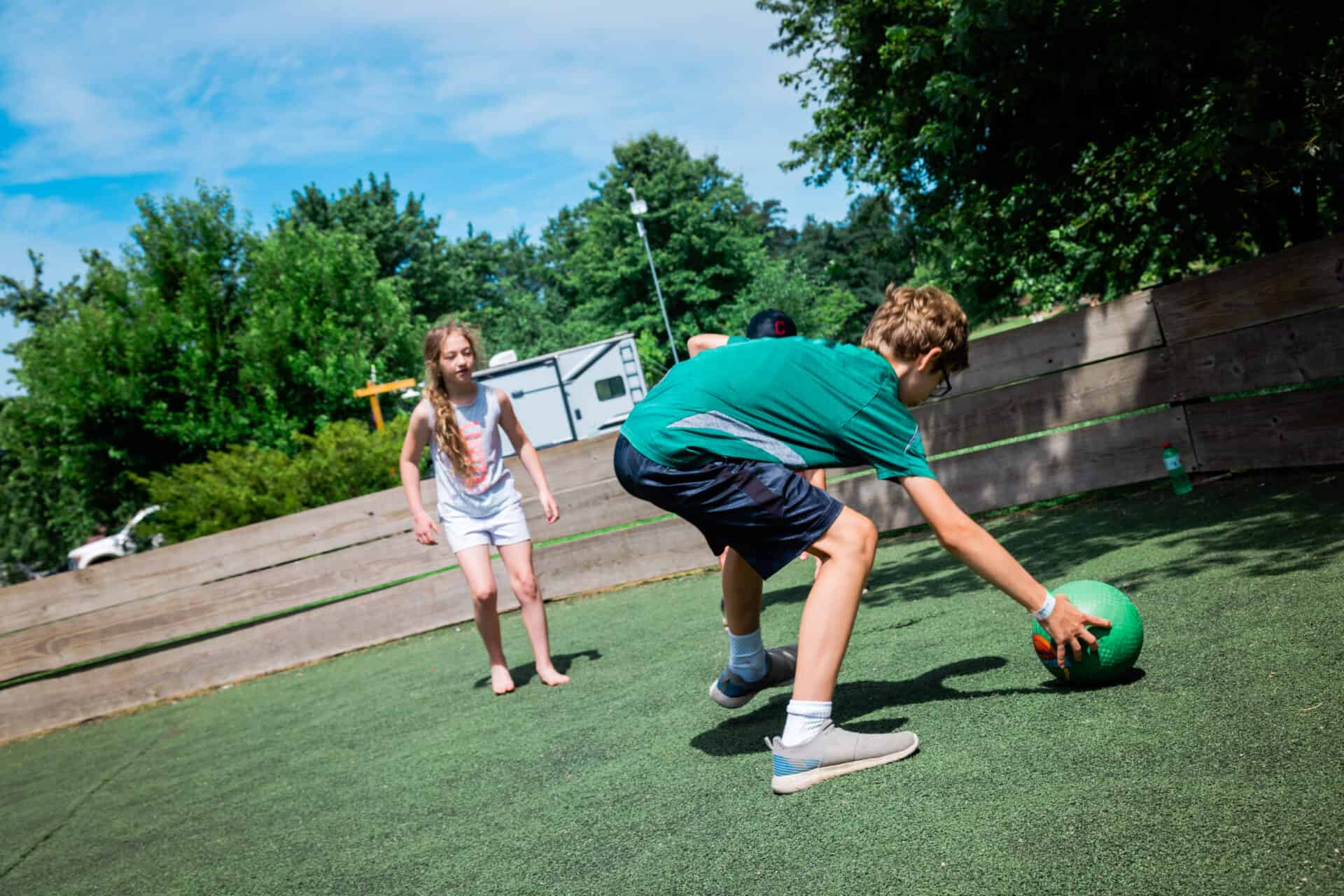 Two children engaging in activities on a playground.
