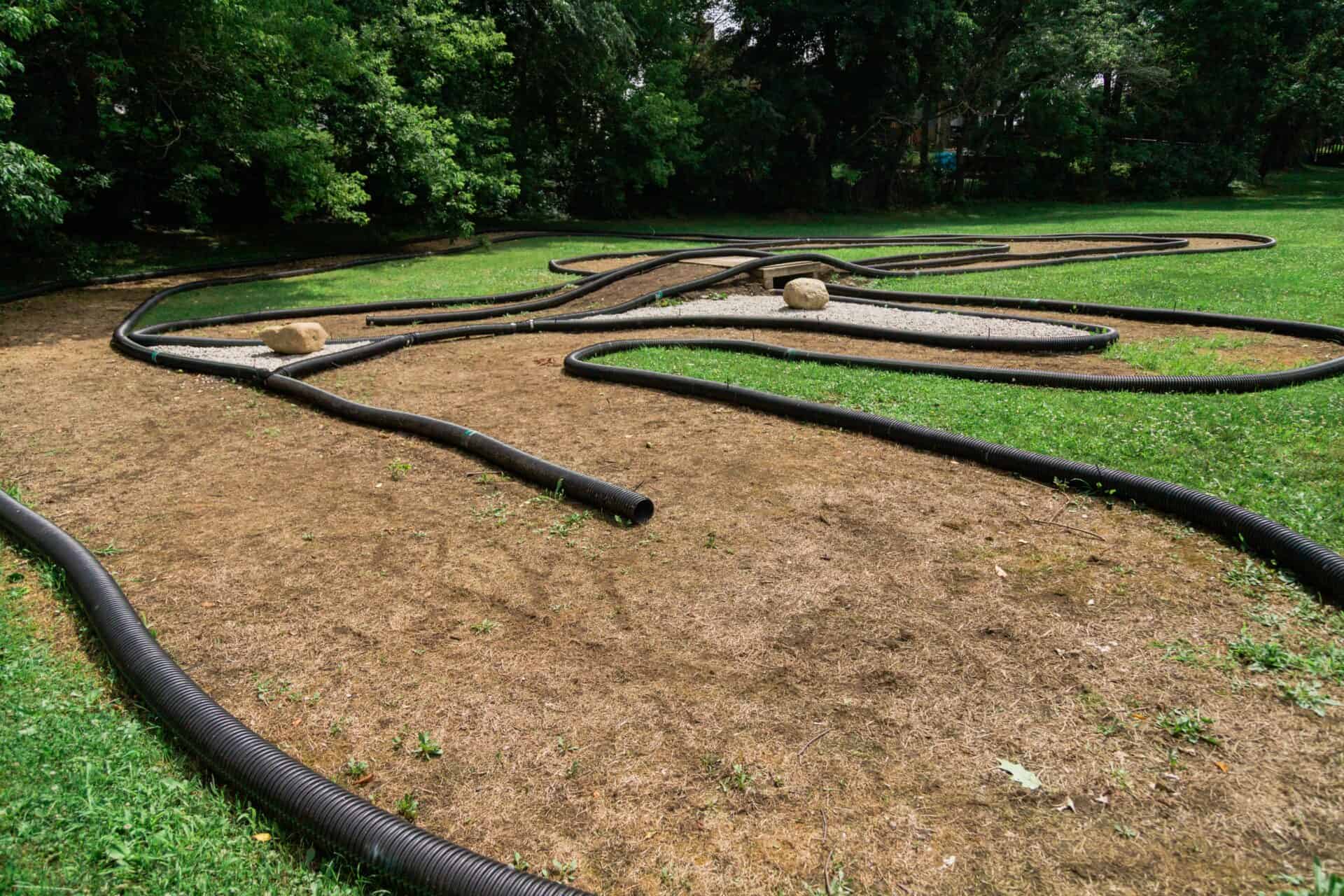 A grassy area with a dirt track perfect for activities.