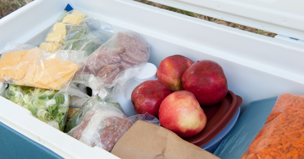Cooler packed with fresh food and prepped ingredients for a family camping trip at Jellystone Park in Northeast Ohio.