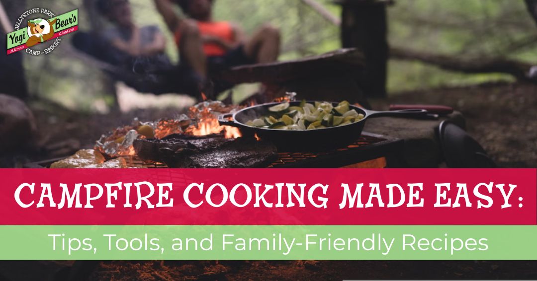 A skillet with food cooks over a campfire on a grill, with blurred people sitting in the background. Text overlay reads: "Campfire Cooking Made Easy: Tips, Tools, and Family-Friendly Recipes.