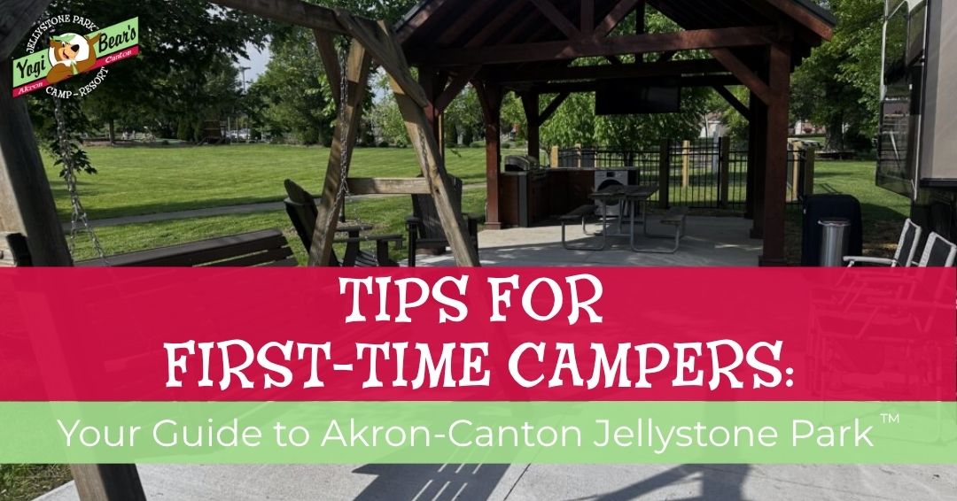 Covered outdoor seating area with tables and chairs at a campground; overlaid text reads, "Tips for First-Time Campers: Your Guide to Akron-Canton Jellystone Park.