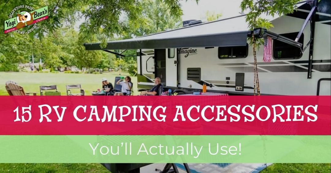 A family relaxes under the awning of a parked RV at a campsite, with text overlay reading "15 RV Camping Accessories You'll Actually Use!"—discover the best camping gadgets for your next adventure.