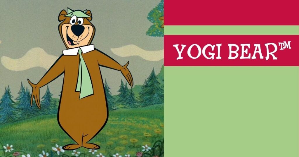 Cartoon bear wearing a green hat and tie stands in a meadow with trees; text on right reads "YOGI BEAR™" in white on a red and green background.