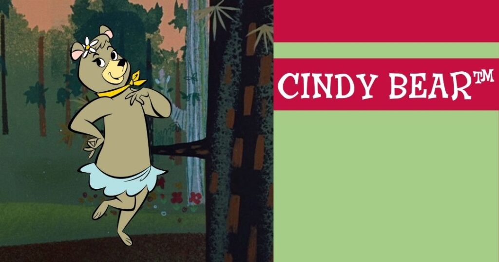Cartoon bear wearing a blue skirt and yellow scarf poses in a forest beside a graphic that reads "Cindy Bear™" on a red and green background.