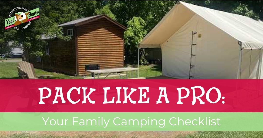 A wooden cabin and a large white tent sit on a grassy campsite under trees. Text reads: "Pack Like a Pro: Your Family Camping Checklist.